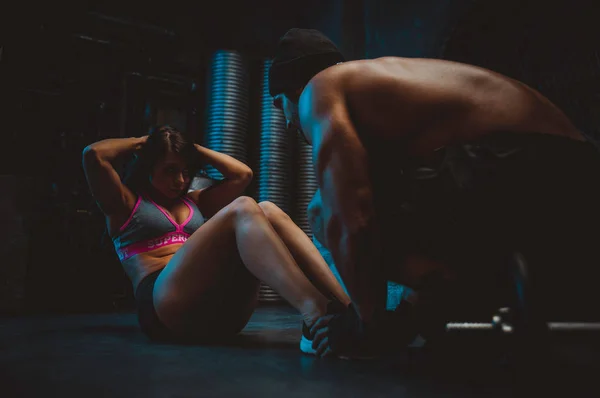 Young people making functional training in the grungy gym