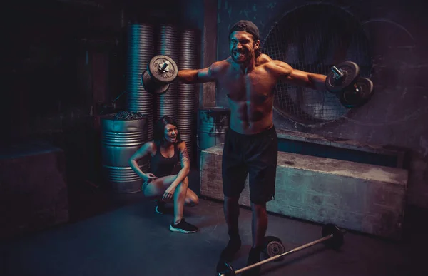 Young people making functional training in the grungy gym Stock Picture