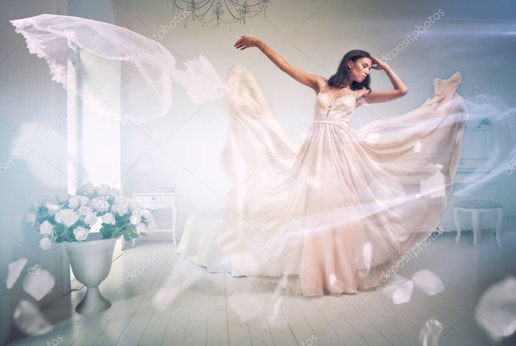 Beautiful woman with fancy wedding dress make preparations for t