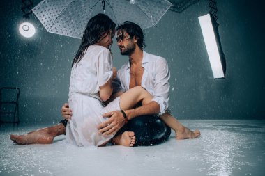 Couple under the rain clipart