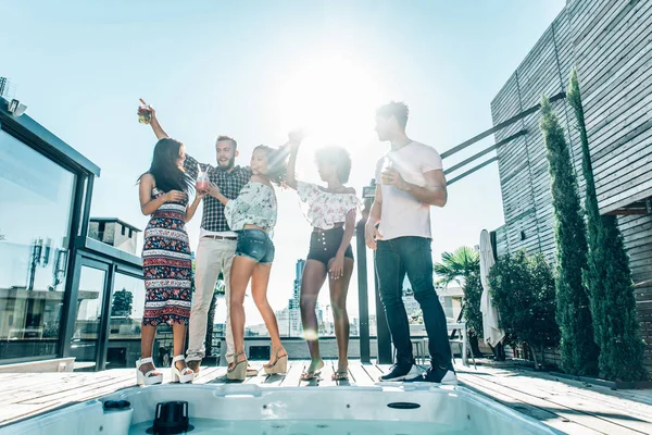 Friends partying on a rooftop