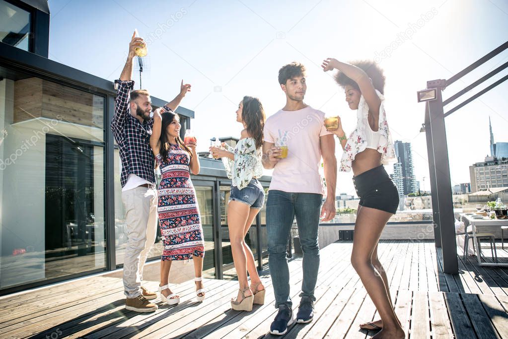 Friends partying on a rooftop