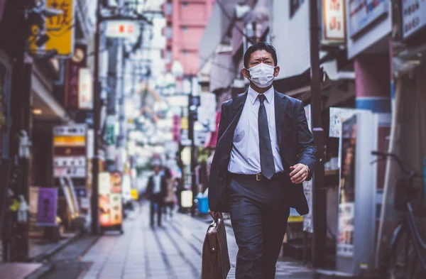 Senior business man moments on the streets of Tokyo Royalty Free Stock Images