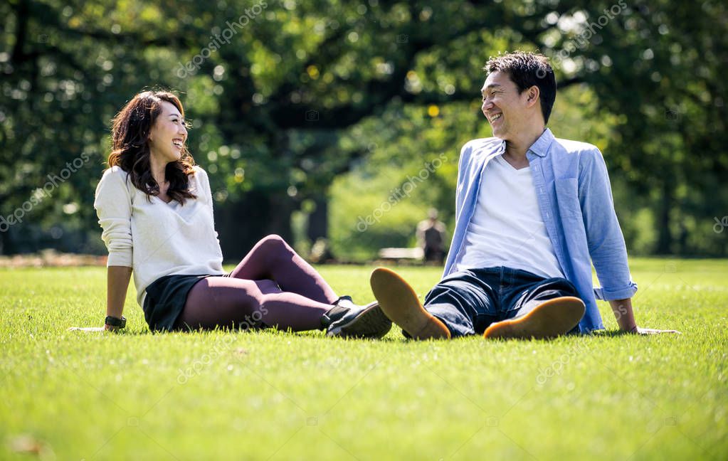 Outdoor watching asian couple