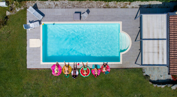Friends having fun in a swimming pool