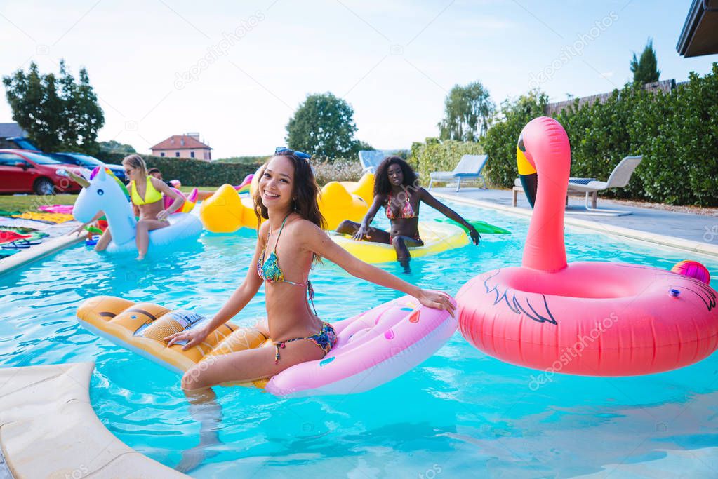 Friends having fun in a swimming pool