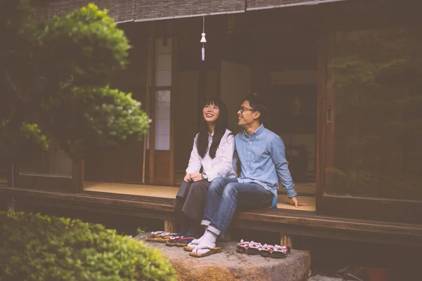 Young japanese couple spending time in their house