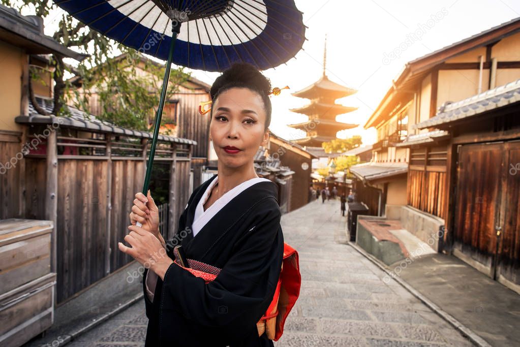 Asian woman with kimono walking at Yasaka Pagoda in Kyoto