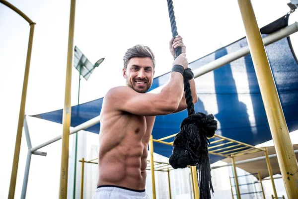 Beautiful man doing work out and different exercises outdoor