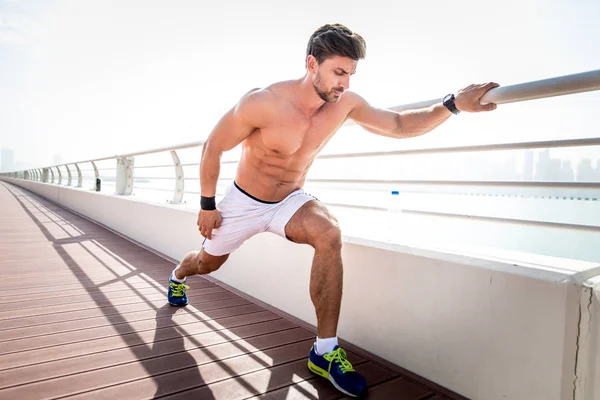 Beautiful man doing work out and different exercises outdoor — Stock Photo, Image