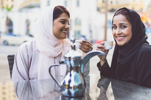 Two arabian girls spending time togehter outdoor making activiti — Stock Photo, Image