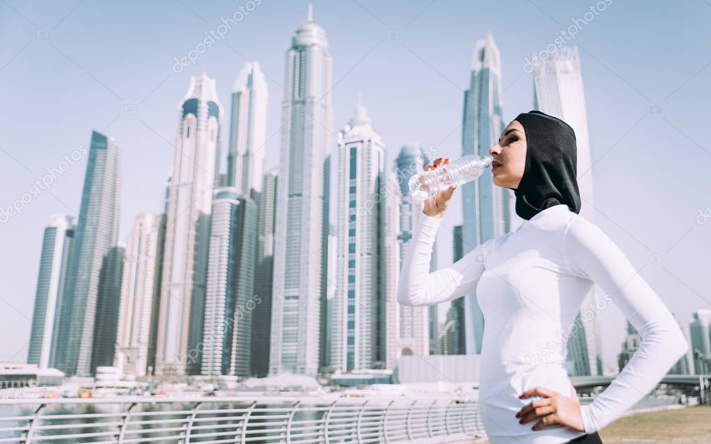 Arabic woman runner, making some urban running