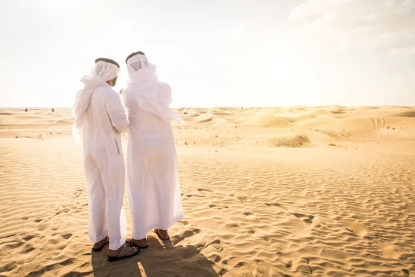 Arabic men in the desert — Stok fotoğraf