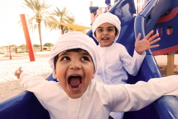 Arabic kids playing at the park in Dubai — Stockfoto