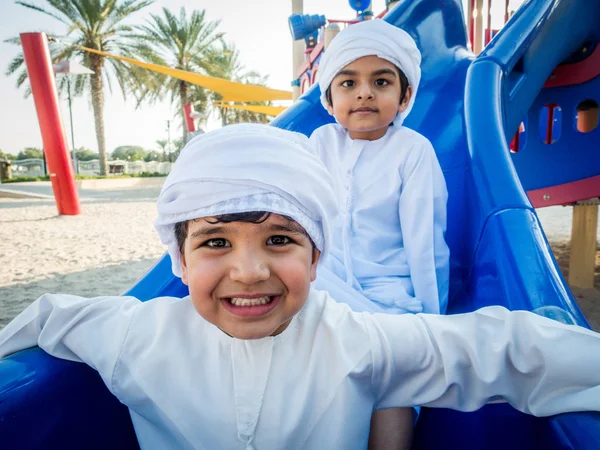 Arabic kids playing at the park in Dubai — Stock Photo, Image