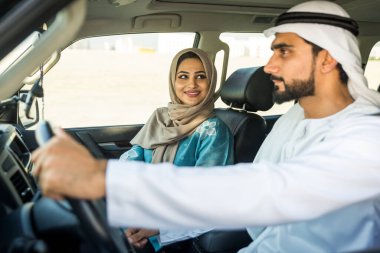 Arabic couple driving in a car