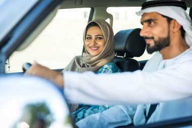 Arabic couple driving in a car