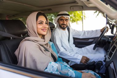 Arabic couple driving in a car