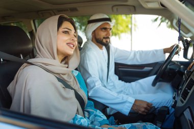 Arabic couple driving in a car