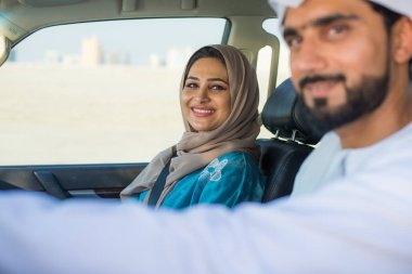 Arabic couple driving in a car
