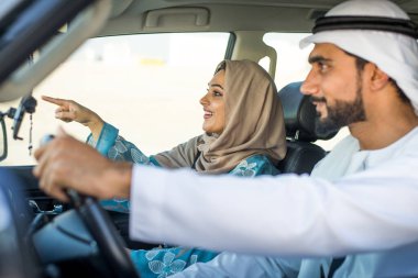 Arabic couple driving in a car
