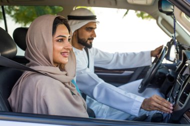 Arabic couple driving in a car