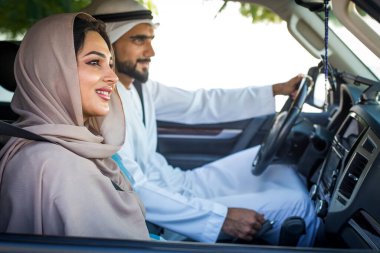 Arabic couple driving in a car