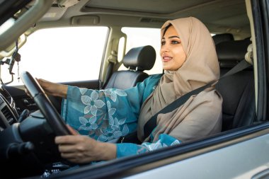 Arabic couple driving in a car