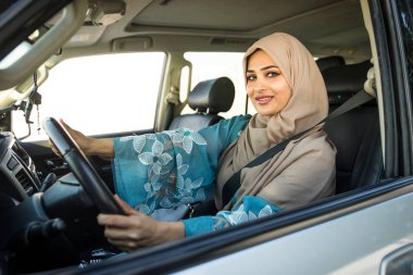 Arabic couple driving in a car