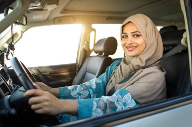 Arabic couple driving in a car