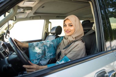 Arabic couple driving in a car