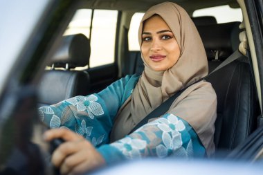 Arabic couple driving in a car
