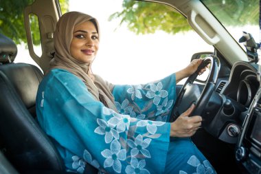 Arabic couple driving in a car
