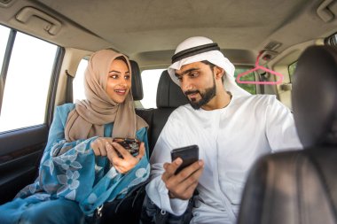 Arabic couple driving in a car