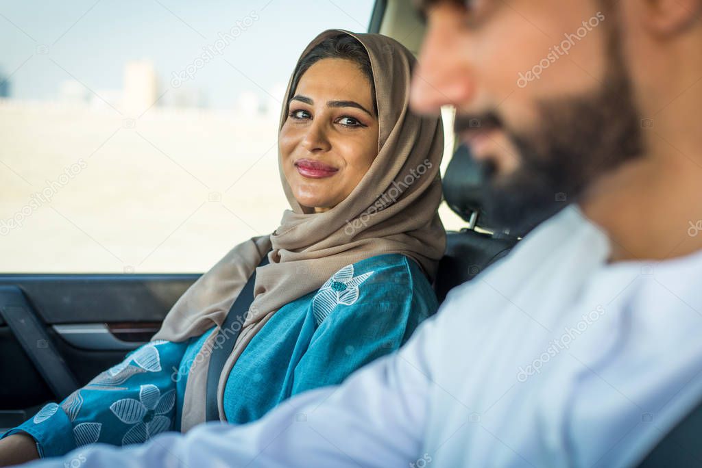 Arabic couple driving in a car