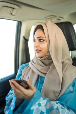 Arabic couple driving in a car