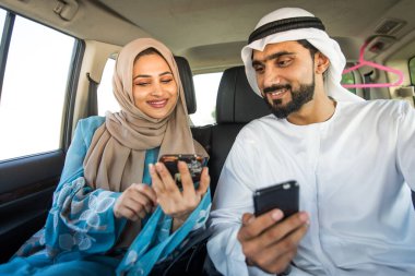 Arabic couple driving in a car