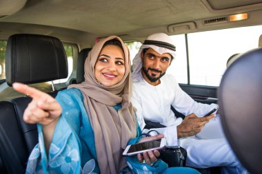 Arabic couple driving in a car