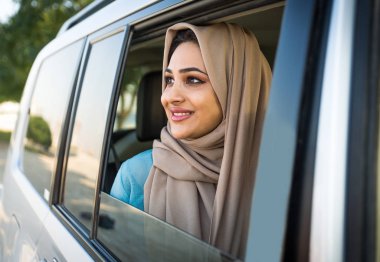 Arabic couple driving in a car