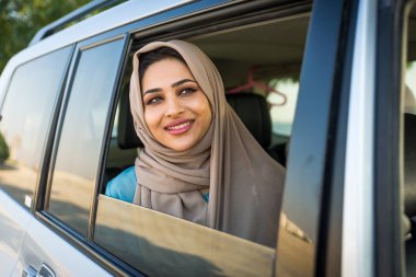 Arabic couple driving in a car