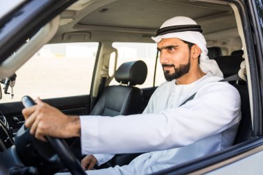 Arabic man driving in a car