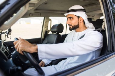 Arabic man driving in a car