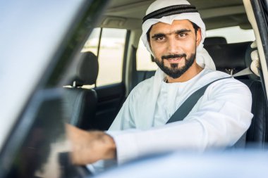 Arabic man driving in a car