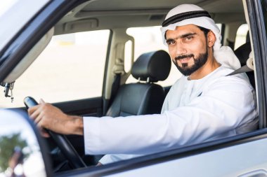 Arabic man driving in a car