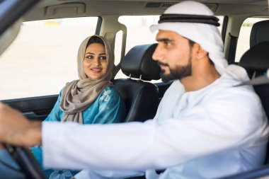 Arabic couple driving in a car