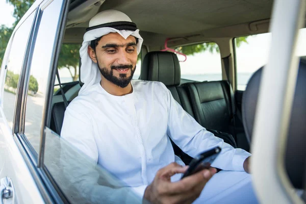 Arabic man driving in a car — Stok fotoğraf