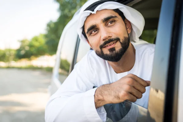 Arabic man driving in a car — Stok fotoğraf