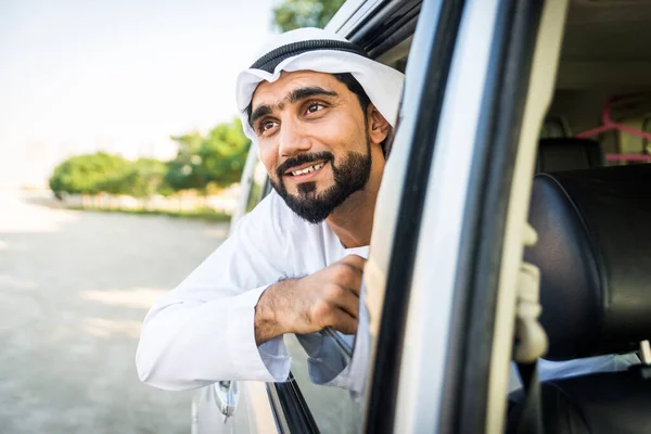 Arabic man driving in a car — Stok fotoğraf