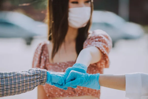 Group of asian girls going out after quarantine during coronavirus period. Young women outdoor with safety masks