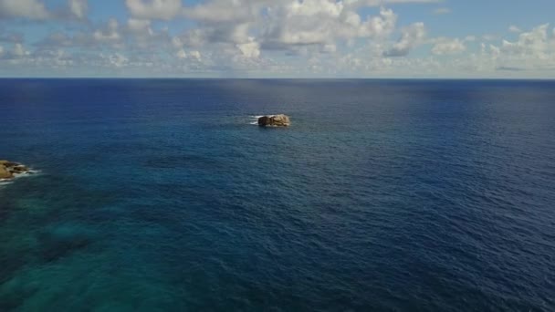 Lonely beautiful rock in the middle of Indian ocean near Seychelles drone shot 4K Footage — Stock Video